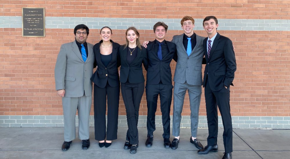 Aaron with his team at a case competition